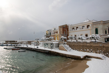 Fototapeta na wymiar Ionian coast after a exceptional snowfall, santa maria al bagno, salento, italy