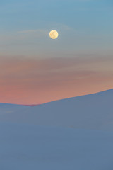 A super moon rising over beautiful white sand dunes at sunset - 191361999