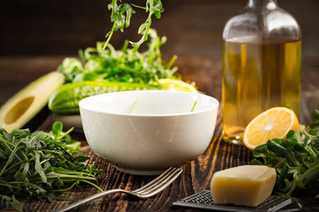 Lettuce and a bottle of olive oil