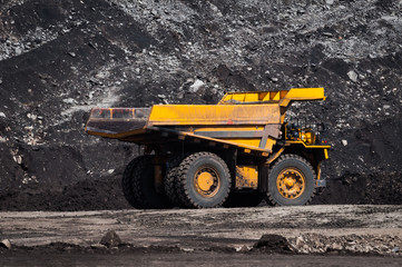 Big dump truck is mining machinery, or mining equipment to transport coal from open-pit or open-cast mine as the Coal Production