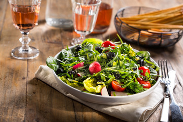 Green salad served on the plate.