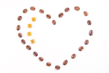 The heart of coffee beans on a white background with inscription love, valentine's day