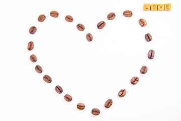 The heart of coffee beans on a white background with inscription love, happy valentine's day
