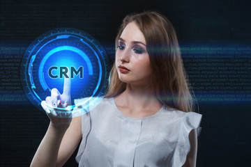 The concept of business, technology, the Internet and the network. A young entrepreneur working on a virtual screen of the future and sees the inscription: CRM