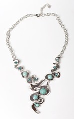 Necklace with stones on a white background. Bijouterie. Women's accessories. Necklace on the neck. Valuable jewelry.Decorating for women.Women's accessories isolated white background