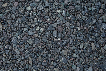Close up grey granite gravel background. Pebble background Gravel texture. Gravel background. Stones texture.