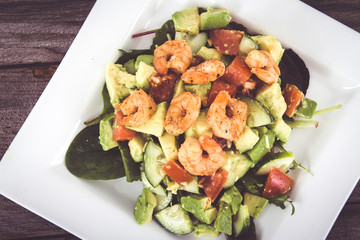 spicy shrimps and avocado salad plate