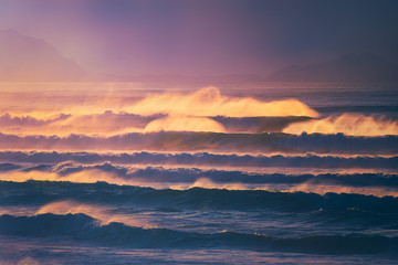 beautiful dreamy seascape with waves at the sunset