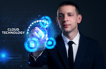Business, Technology, Internet and network concept. Young businessman working on a virtual screen of the future and sees the inscription: Cloud technology