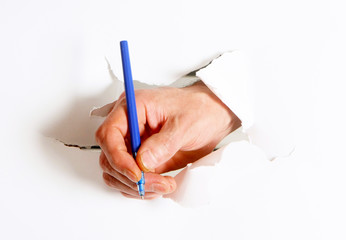A man's hand holds a ballpoint pen. Fingers write on white background. The concept of business and finance. Horizontal image.