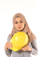 Hijab collage with safety helmet.