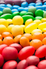Fototapeta na wymiar Colorful rainbow candies with selective focus