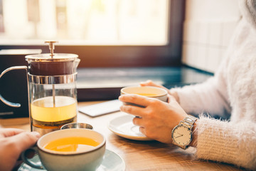woman drink hot orange tea