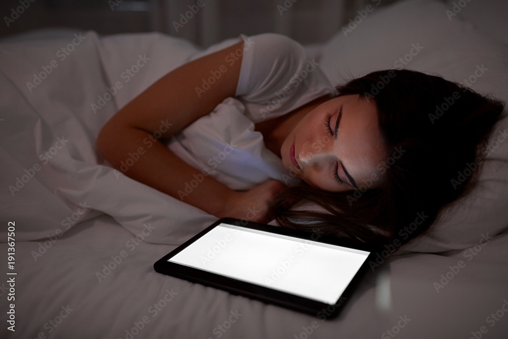 Poster woman with tablet pc sleeping in bed at night