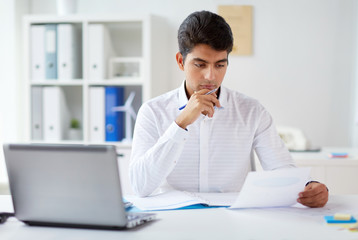 businessman working with papers at office