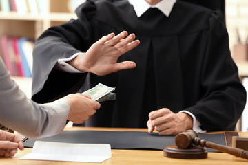 Male judge refusing to take bribe from woman, closeup