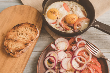 Lunch in a rustic style pub - fried eggs, salad and toasted bread