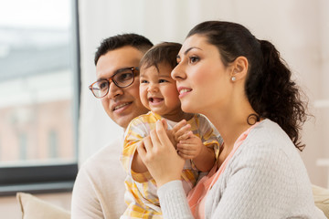 happy family with baby daughter at home