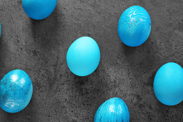 Dyed Easter eggs on grey background