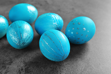 Dyed Easter eggs on grey background