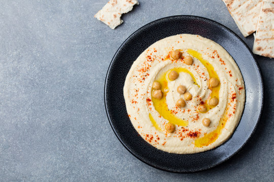 Hummus, chickpea dip, spices and pita, flat bread