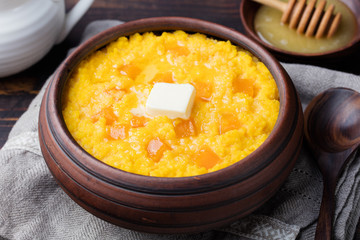 Millet porridge with pumpkin in a clay bowl