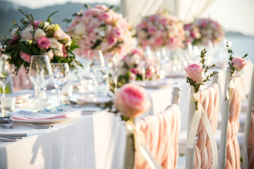 Table setting at a luxury wedding and Beautiful flowers on the table.