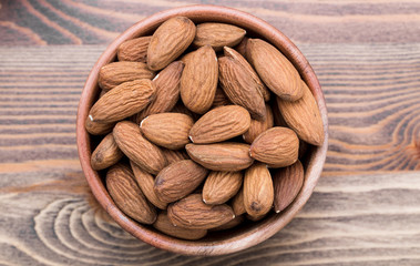 Almonds in wooden plate