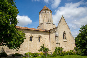 Exterior view of a Catholic Church under bue sky