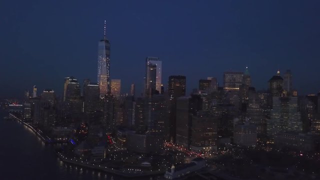 dusk flying east along south end of Manhattan