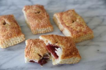 Sweet pastries on marble surface, close-up