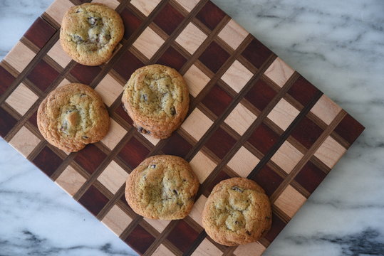 Cookies on chequered surface, elevated view