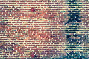 Aged photo on redbrick wall