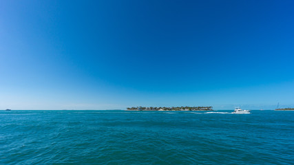 USA, Florida, Sunset key island from mallory square at key west with boat