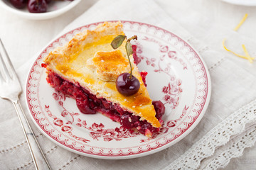 Slice of cherry pie with ice cream