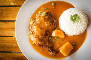 Chicken baked with red sauce. Served with jasmin rice. Japanese style. Top view and copy space.