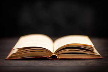 Open book on dark background