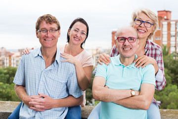 smiling mature people in glasses