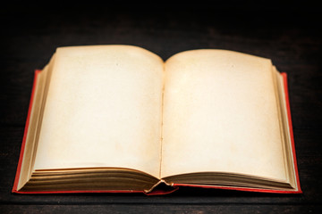 Open book on white wood background