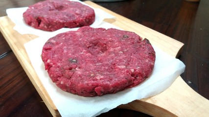 Two big raw burgers