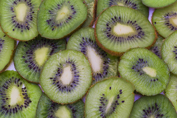 The cut kiwi fruit. Close-up background texture