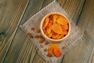 Sweet dried apricots and raisins. The concept is healthy food, vegetarianism, diet, vitamins.