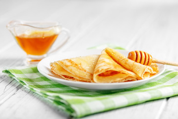 Sweet pancakes with honey. The concept of food, breakfast,  pancake week.
