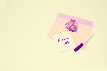 letter, Valentine card, pen, notebook on table
