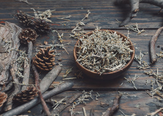 Aromatic dry herb of alternative medicine - wormwood on a wooden table