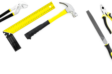 Tools for repair and building. Hummer, file, corner ruler, pilers on white background top view copy space