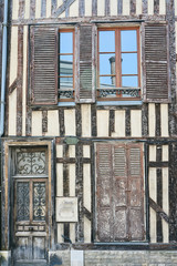 door and windows of the tenement houses in old town of Troyes, France.