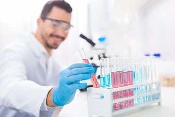 Appealing male laboratorian needs reagent