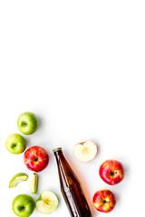 Apple cider. Low-alcoholic beveradge in dark bottle on white background top view copy space