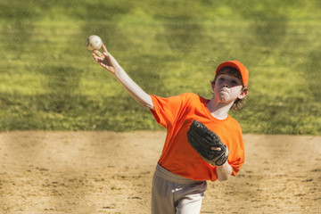 Naklejka premium Youth Pitcher Releasing Ball
